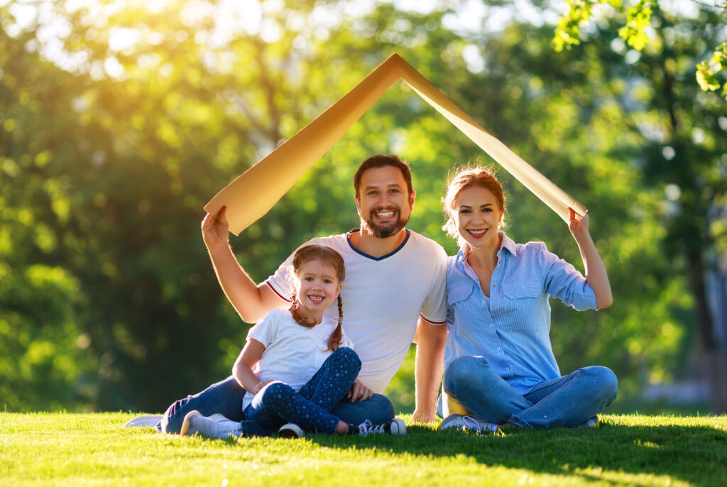 family under a cardboard