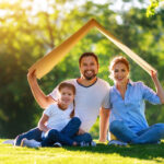 family under a cardboard